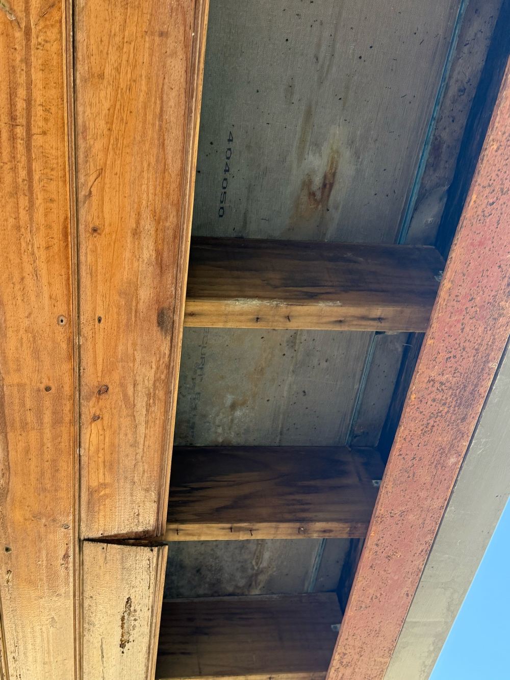 Structural balcony flooring with mould on its underside after long exposure to damp, found during a defect investigation inspection in Officer