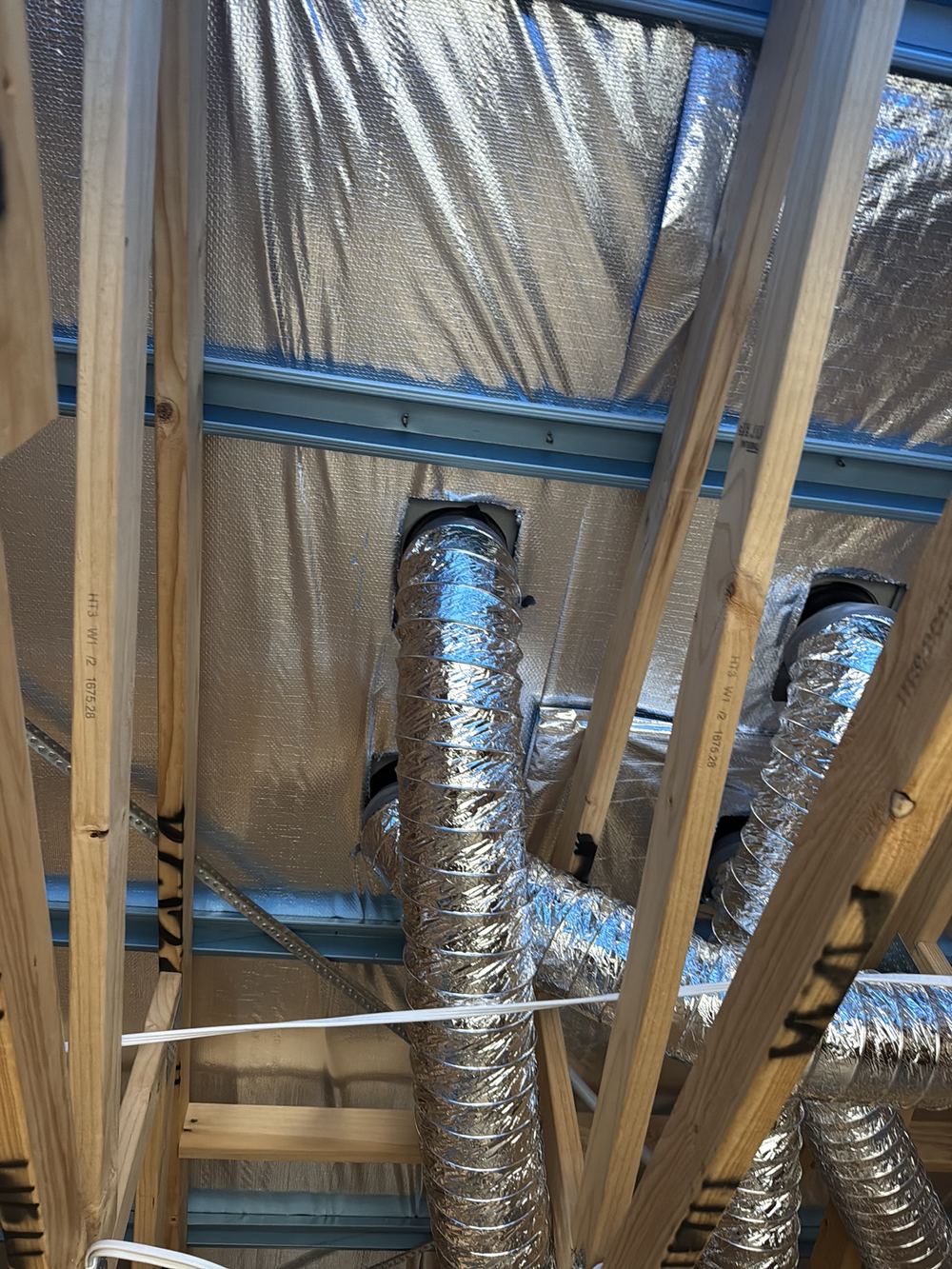 Roof penetrations cut through the sarking with no tape or collar to reseal it, found during a lock-up inspection in Officer
