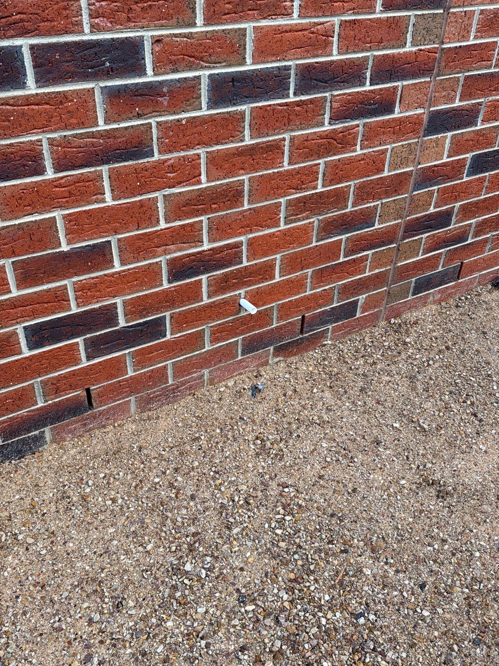 Air conditioner condensate draining onto the ground instead of into stormwater, found during a pre-handover inspection in Officer