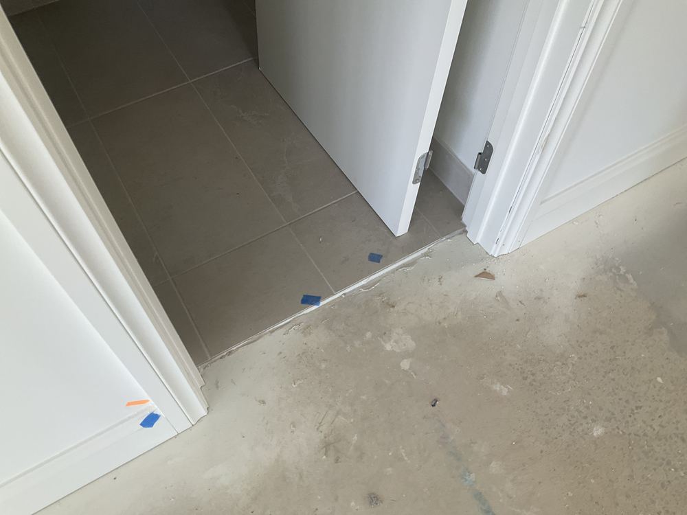 Wall corner finished out of square and noted for the builder, found during a pre-handover inspection in Officer