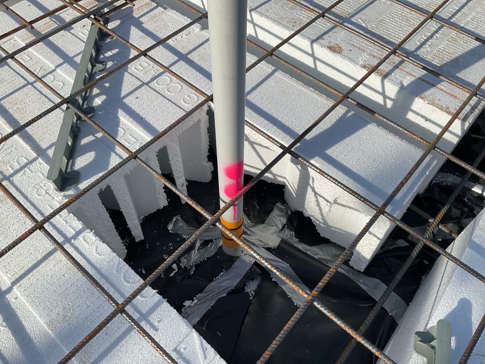 Mesh touching a plumbing penetration where a 25mm gap has to be kept, found during a slab pre-pour inspection in Officer